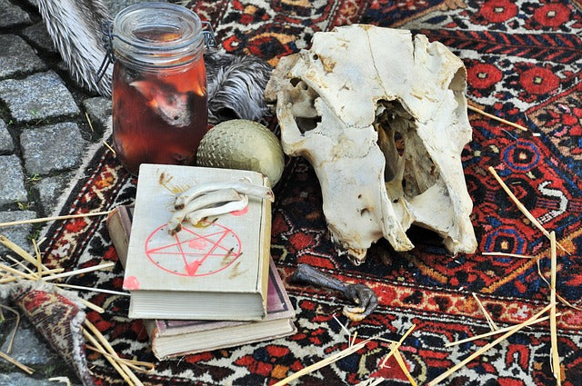 witch books a skull and magic supplies